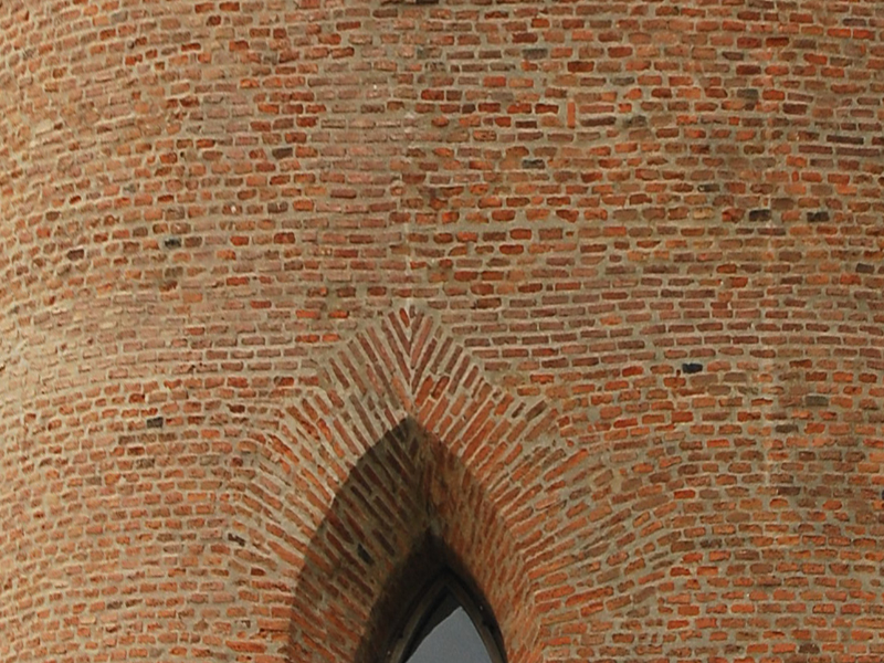 Brick Castle Tower With Gothic Windows