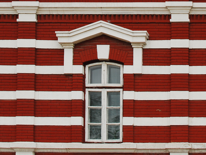 Building Face With Red And White Bricks