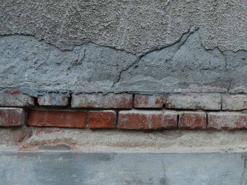 Cracked Wall With Bricks Mortar And Cement