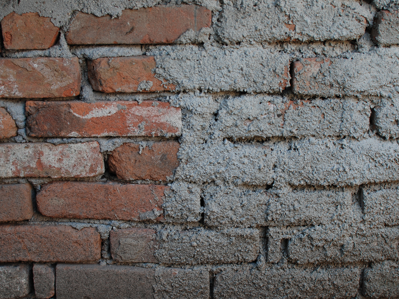 Old Brick Wall With Rough Cement Texture