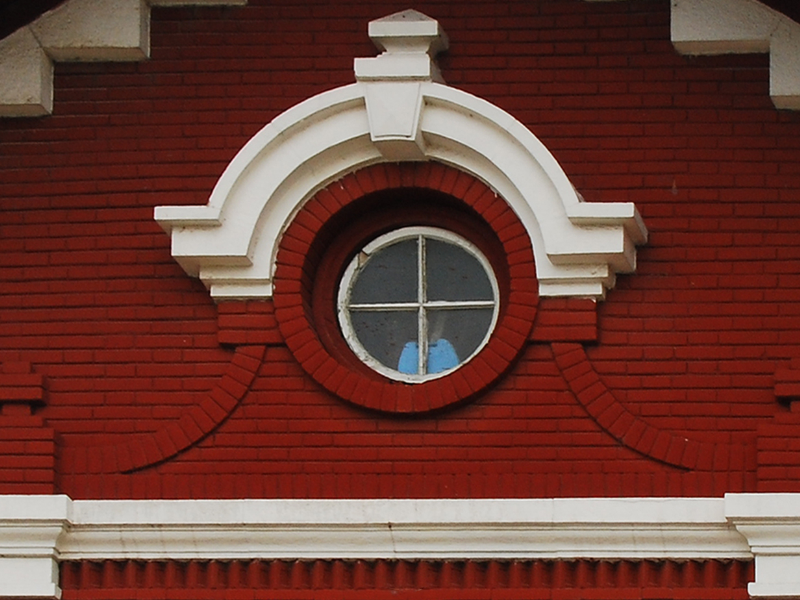 Red Brick White Round Window